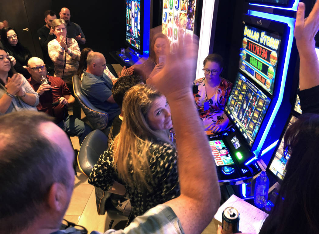 A group gathers to cheer on a big win on the slots while overall shopping, dining and gambling ...