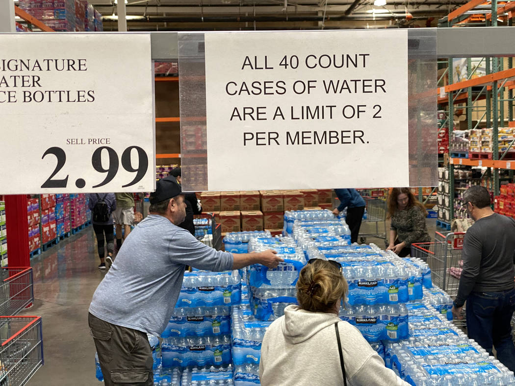 Shoppers at Costco at 6555 N. Decatur Blvd. in Las Vegas buy water Monday, March 9, 2020. (K.M. ...