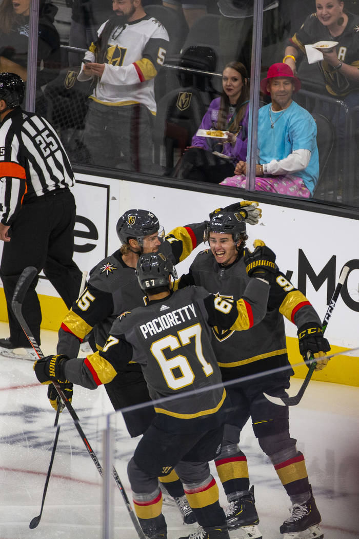 Vegas Golden Knights center Cody Glass (9, right) celebrates his score on San Jose Sharks goalt ...