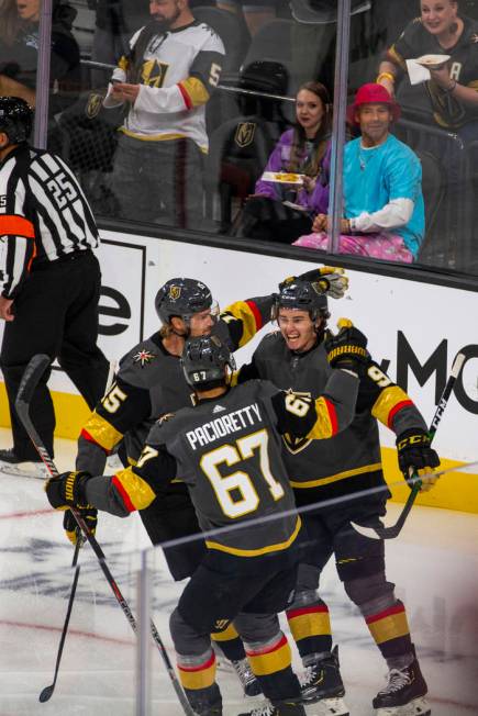 Vegas Golden Knights center Cody Glass (9, right) celebrates his score on San Jose Sharks goalt ...