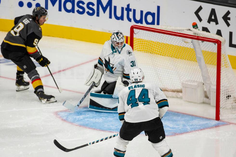 Vegas Golden Knights center Cody Glass (9) scores on San Jose Sharks goaltender Martin Jones (3 ...