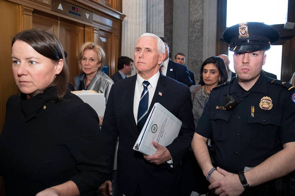Vice President Mike Pence, center, who is the head of President Donald Trump's coronavirus task ...
