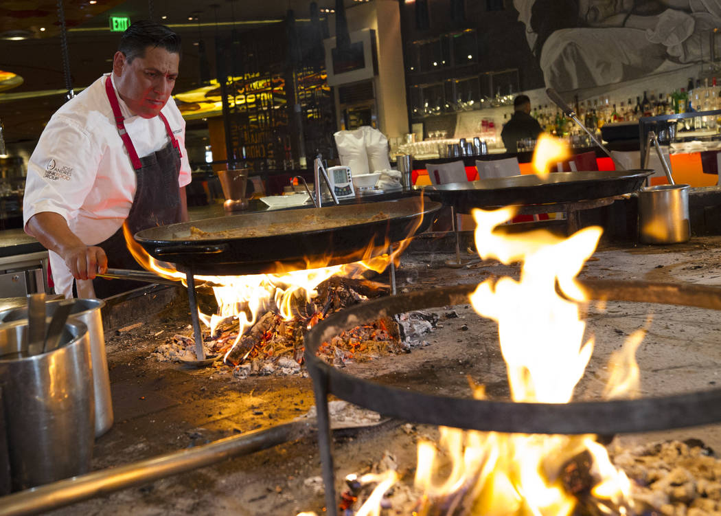 Luis Montesinos, head chef of Jaleo by Jose Andres, prepares a classic Paella Valenciana Rafael ...