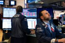 Trader Peter Tuchman works on the floor of the New York Stock Exchange Monday, March 16, 2020. ...