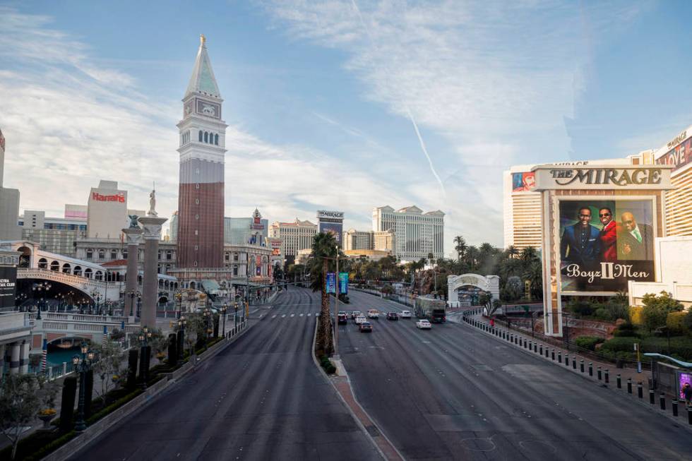 A few cars drive on Las Vegas Blvd., through the Las Vegas Strip on Monday morning, March 16, 2 ...