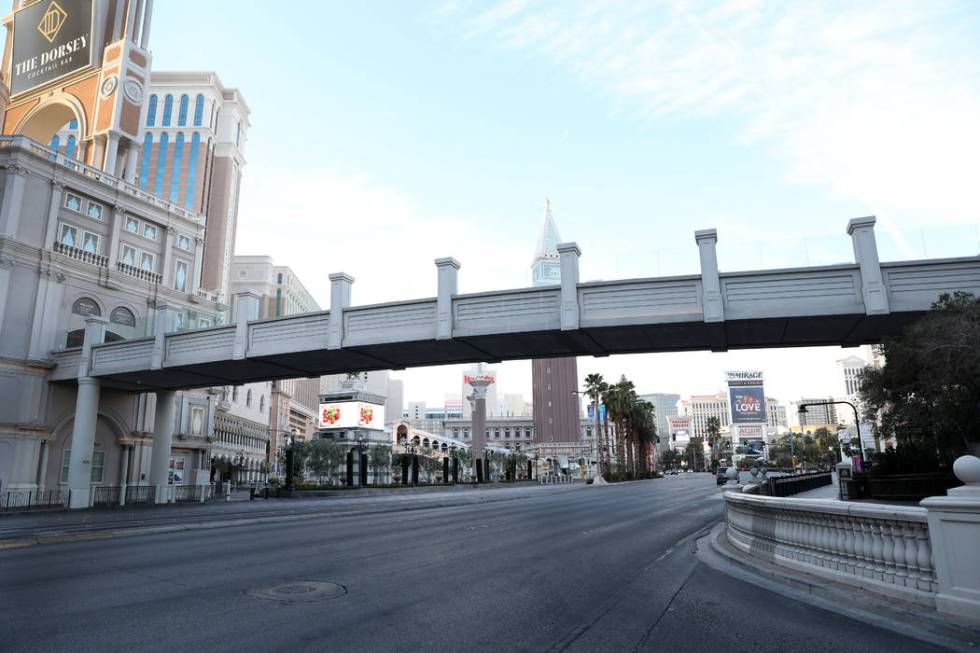 A few cars drive on Las Vegas Blvd., through the Las Vegas Strip on Monday morning, March 16, 2 ...