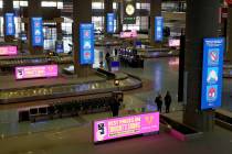 Safety signs at the baggage claim area at McCarran International Airport in Las Vegas Monday, M ...