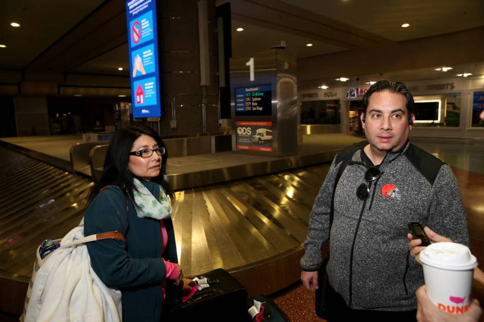 Robert and Tanya Garcia of the Cleveland talk to a reporter in the baggage claim area at McCarr ...