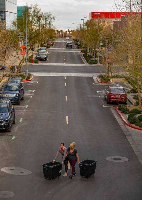 Callyn Snow, left, and Hayley Dunn with Bath & Body Works go to collect incoming packages a ...