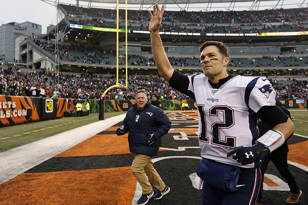 New England Patriots quarterback Tom Brady (12) waves to the crowd after an NFL football game a ...