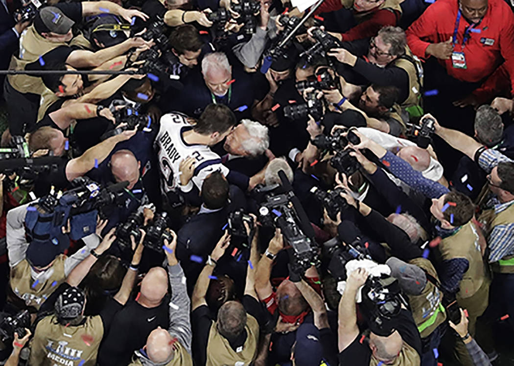 New England Patriots' Tom Brady embraces Patriots owner Robert Kraft after the NFL Super Bowl 5 ...