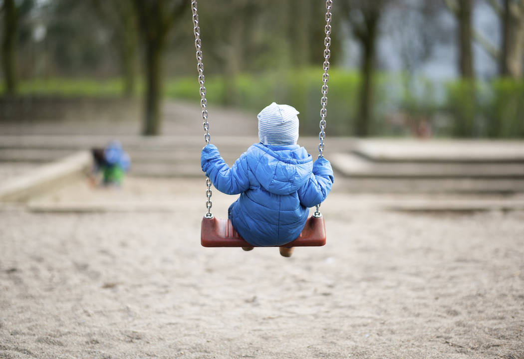 A toddler rocking on a playground in Hamburg, Germany, Tuesday, March 17, 2020. Due to the coro ...