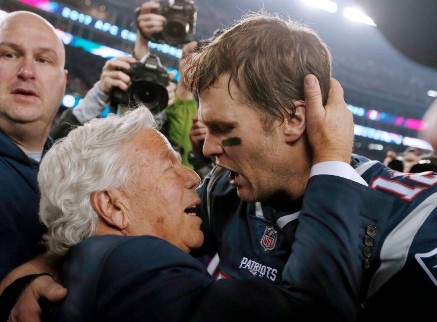 FILE - In this Jan. 21, 2018, file photo, New England Patriots owner Robert Kraft, left, embrac ...