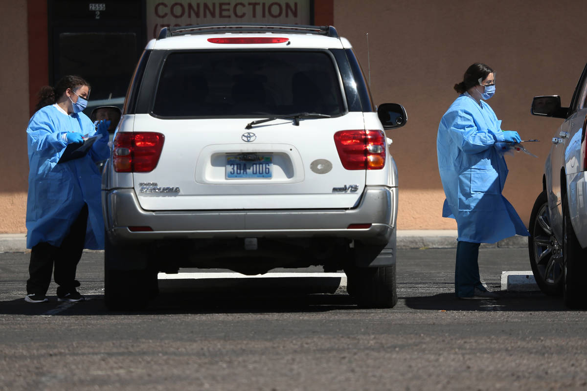 Lab technicians and phlebotomists assist people at the Sahara Urgent Care & Wellness center in ...