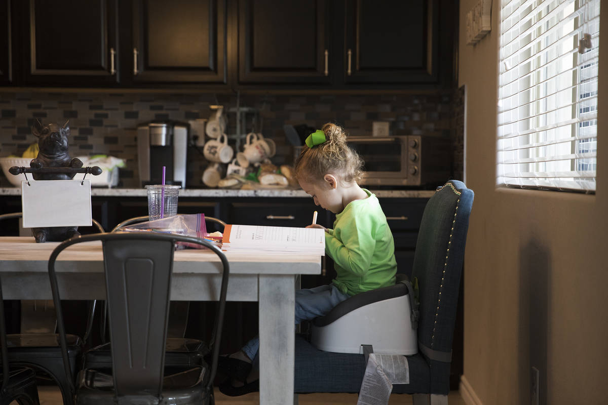 Angie Doleshal, 3, colors at her home in Henderson, Tuesday, March 17, 2020. Clark County Schoo ...