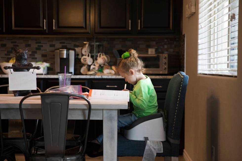 Angie Doleshal, 3, colors at her home in Henderson, Tuesday, March 17, 2020. Clark County Schoo ...