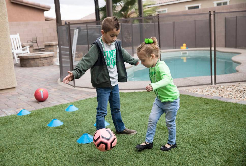 Alex Doleshal, 6, left, plays with his sister, Angie, 3, right, at their home in Henderson, Tue ...