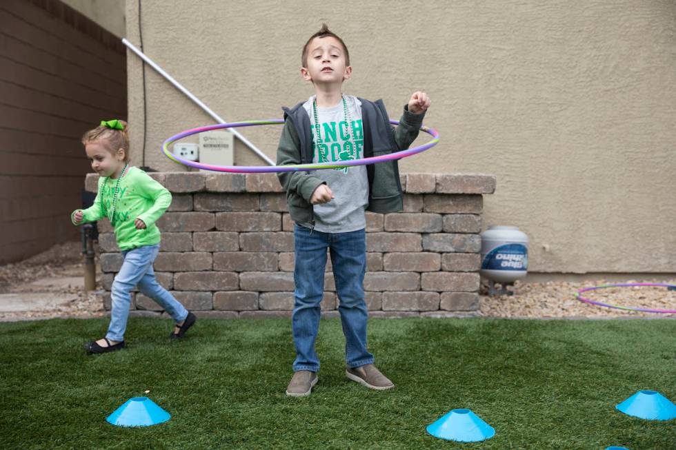 Angie Doleshal, 3, left, plays with her brother, Alex, 6, at their home in Henderson, Tuesday, ...