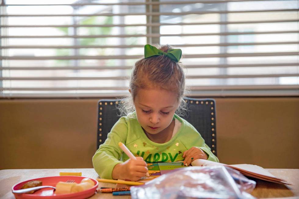 Angie Doleshal, 3, colors at her home in Henderson, Tuesday, March 17, 2020. Clark County Schoo ...