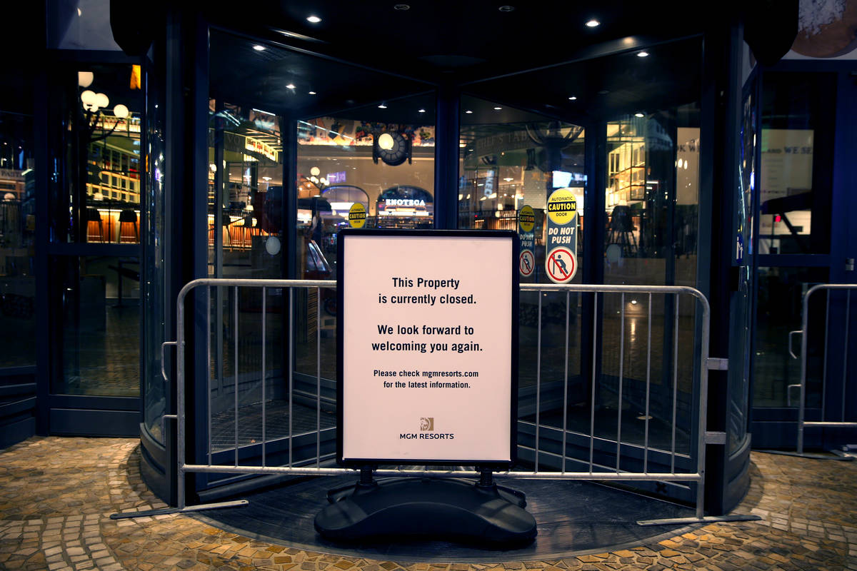 A sign notifies the public that Eataly is temporarily closed as nonessential business closures ...