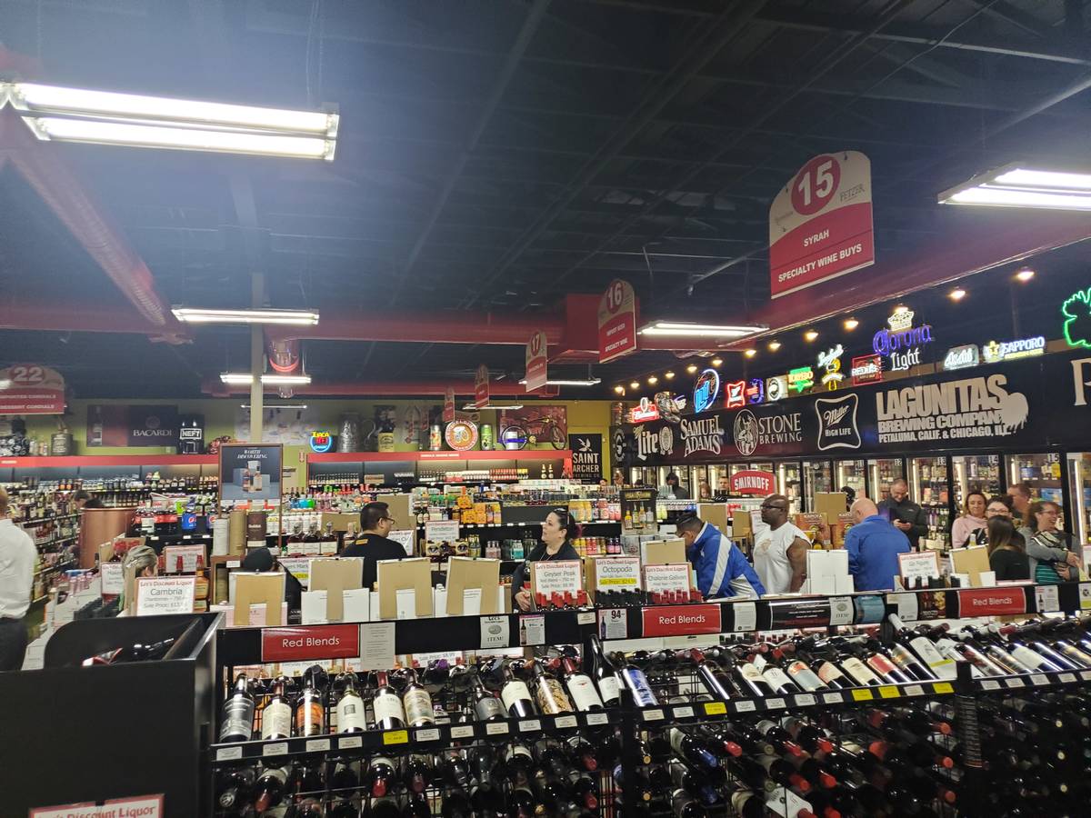 The line to the cashier at a Lee's Discount Liquor Tuesday night. (Adam Hill/Las Vegas Review-J ...