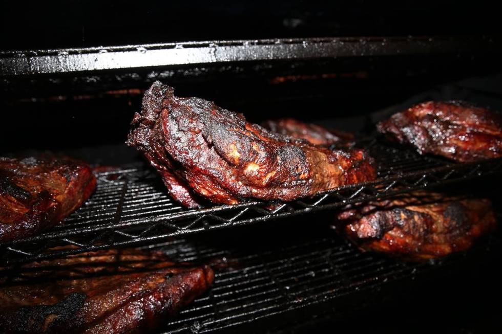 Briskets inside a pit at Big B's Texas BBQ in Henderson, Saturday, June 22, 2019. (Erik Verduzc ...