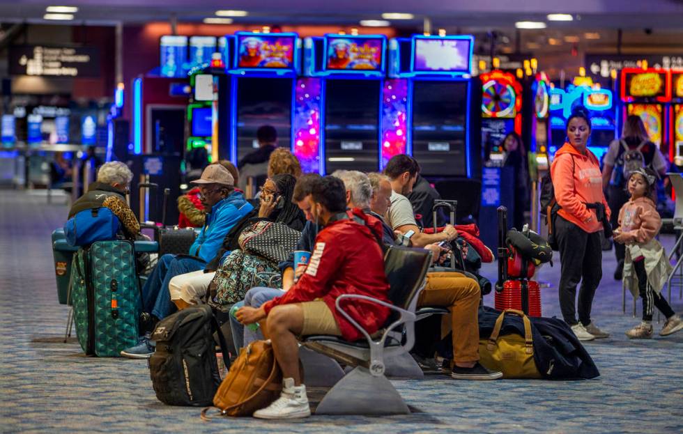Passengers kill some time awaiting their flights in Terminal 1 at McCarran International Airpor ...