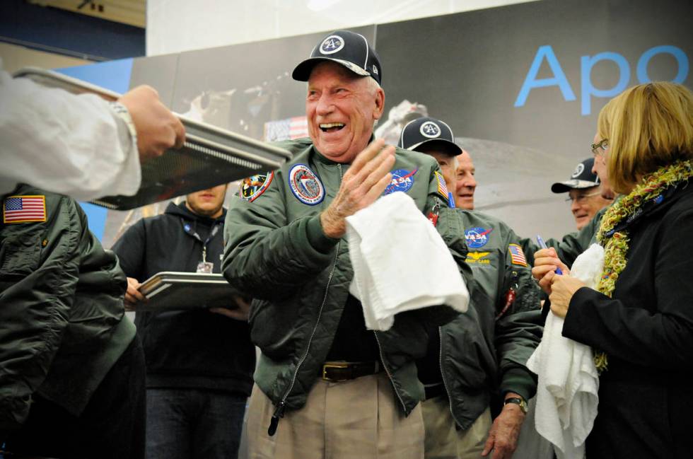 FILE - In this Wednesday, Nov. 12, 2014 file photo, Apollo 15 astronaut Al Worden wipes his han ...