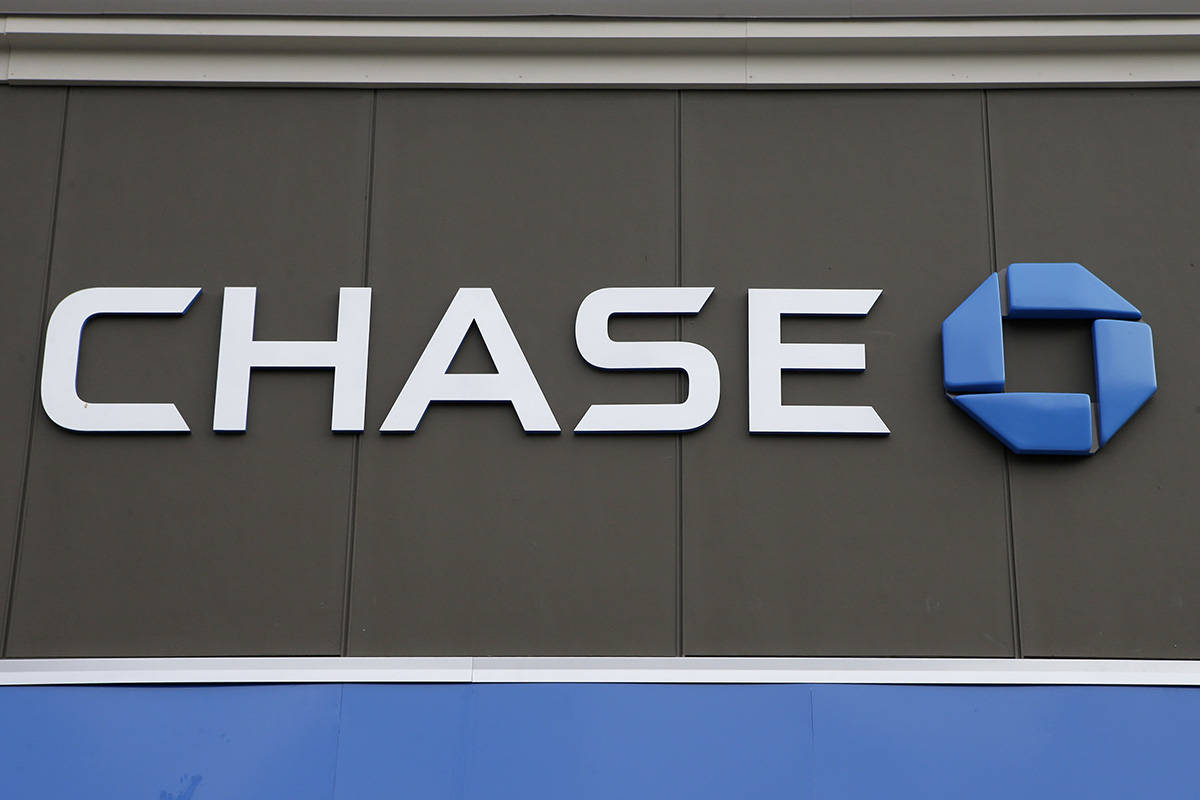 In this Nov. 29, 2018, photo, a Chase Bank logo is attached to an exterior wall at a bank locat ...