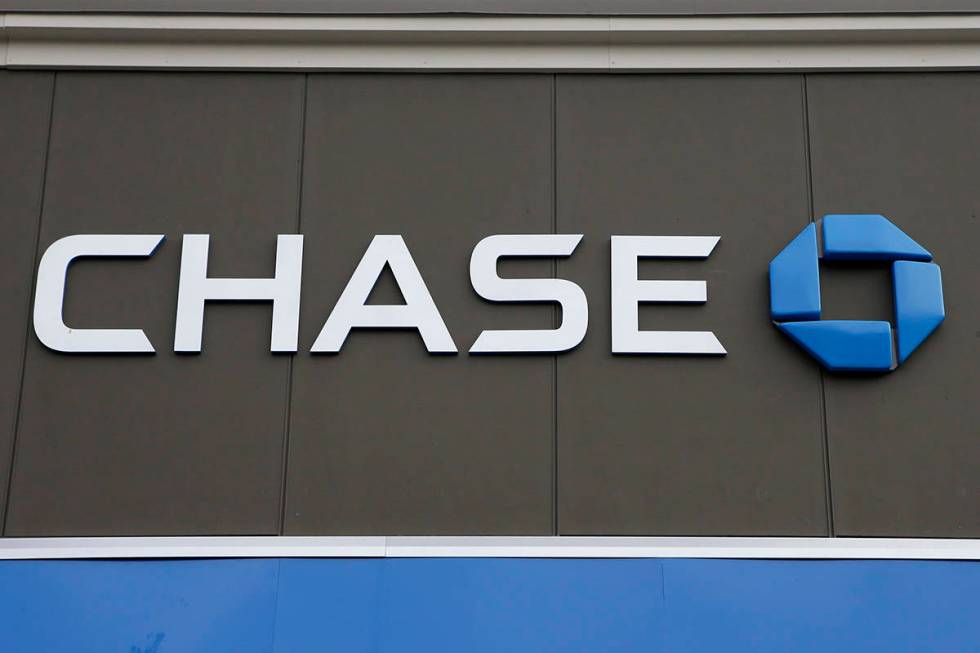 In this Nov. 29, 2018, photo, a Chase Bank logo is attached to an exterior wall at a bank locat ...