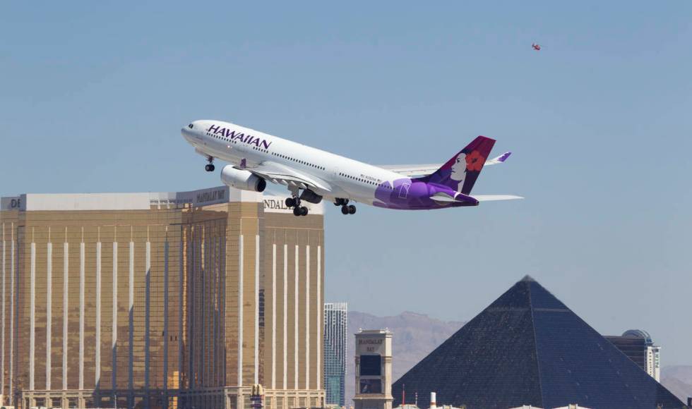 A Hawaiian Airlines jetliner departs from McCarran International Airport in Las Vegas on Wednes ...