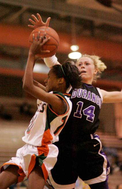 Lindy La Rocque of Durango High School, right, goes up to block Chelsea Hopkins of Mojave High ...