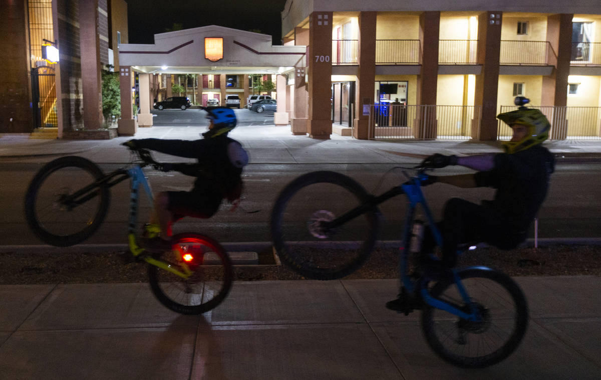 Bikers ride on Fremont Street in downtown Las Vegas, which is largely empty due to concerns rel ...