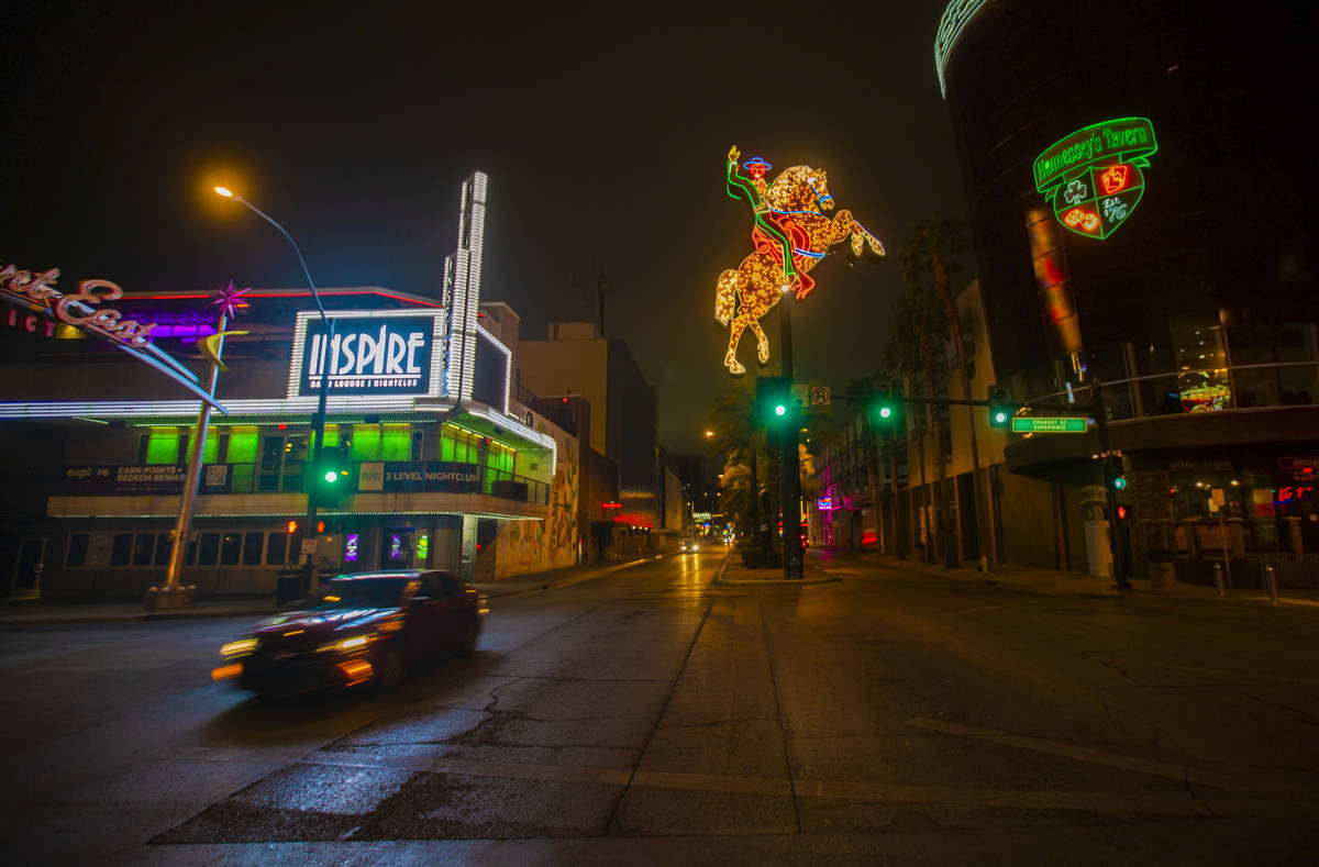 The streets of downtown Las Vegas are largely empty due to concerns related to the spread of th ...