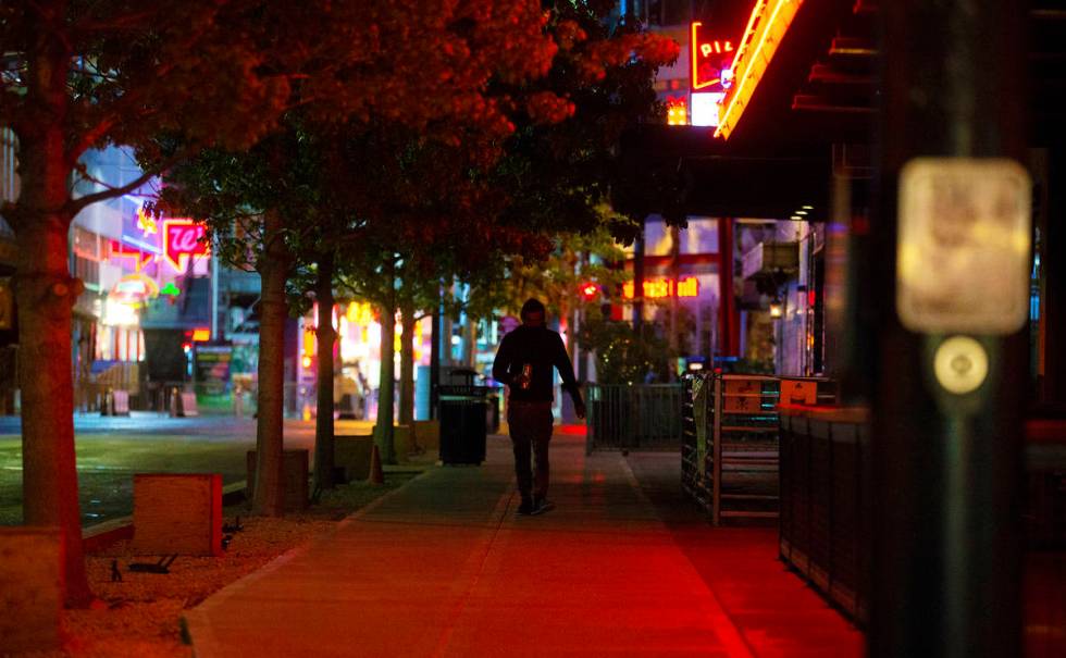 The streets of downtown Las Vegas are largely empty due to concerns related to the spread of th ...