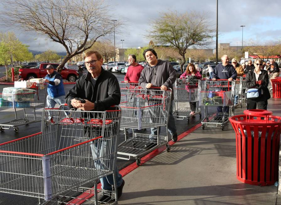 Seniors line up outside Costco on Friday, March 20, 2020, in Henderson. The store reserved earl ...