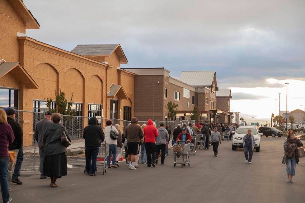 Seniors line up outside of a Smith's Marketplace located at 9710 West Skye Canyon Park Drive in ...