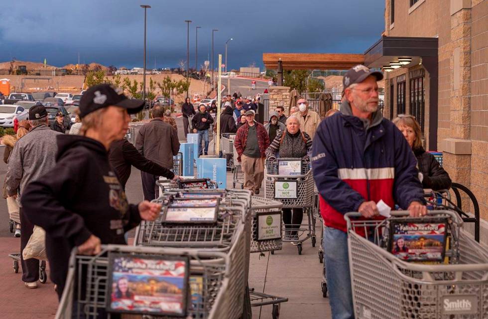 Seniors line up at the Smith's Marketplace located at 9710 West Skye Canyon Park Drive in Las ...