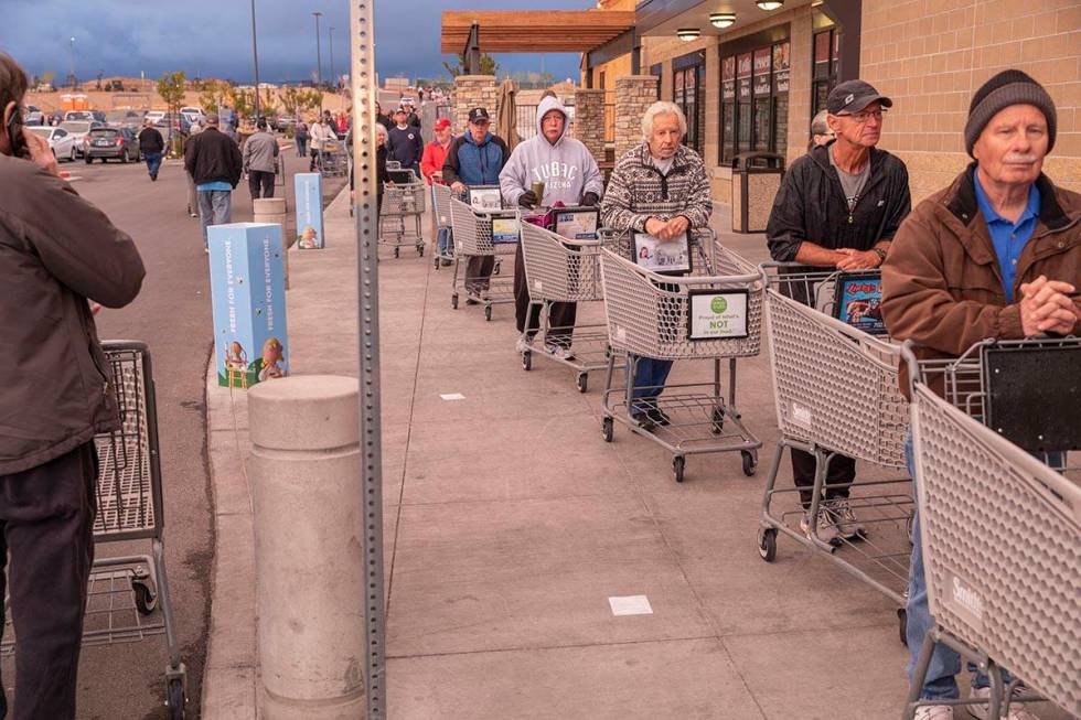 Seniors line up outside of a Smith's Marketplace located at 9710 West Skye Canyon Park Drive in ...