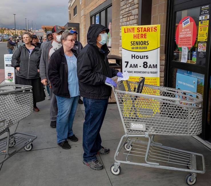 Seniors line up outside of a Smith's Marketplace located at 9710 West Skye Canyon Park Drive in ...