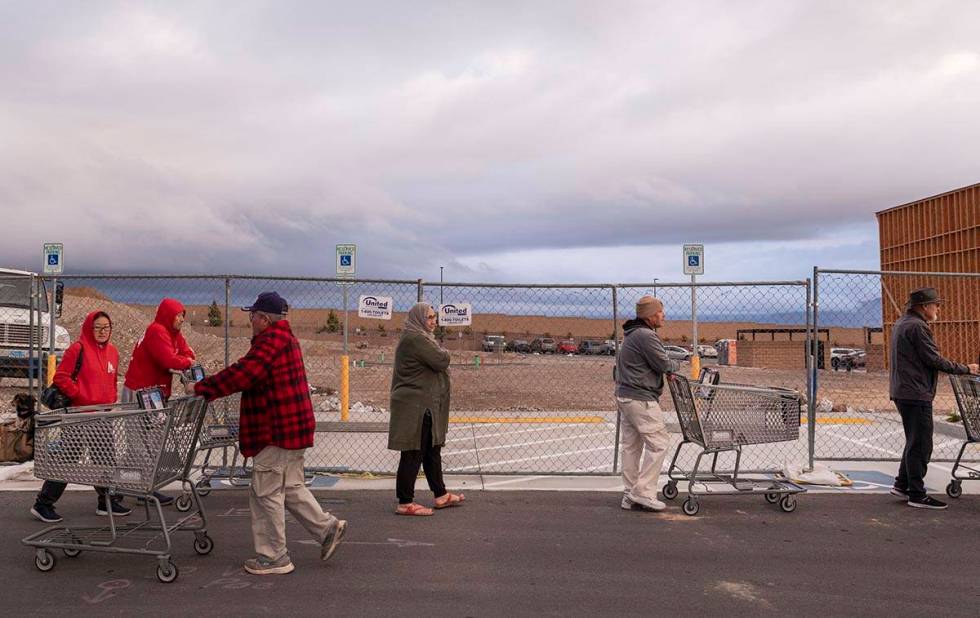 Seniors line up outside of a Smith's Marketplace located at 9710 West Skye Canyon Park Drive in ...