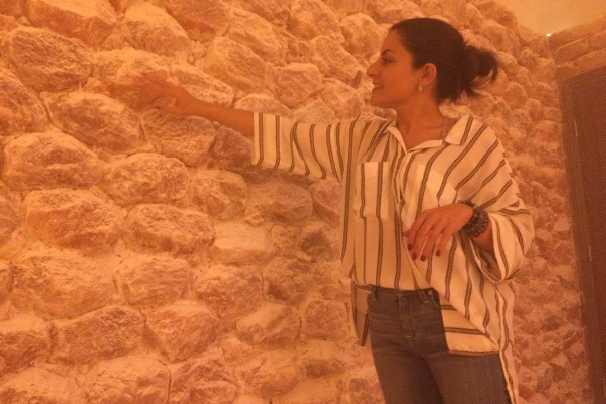 Ava Mucikyan brushes off the minuscule layer of salt that results from her Himalayan salt cave ...