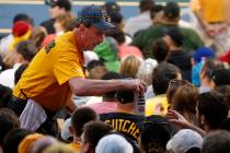 A PNC Park beer vendor serves a beer during a baseball game between the Pittsburgh Pirates and ...