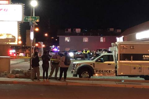 Police investigate a shooting in the 4700 block of East Craig Road in Las Vegas on Friday, Marc ...