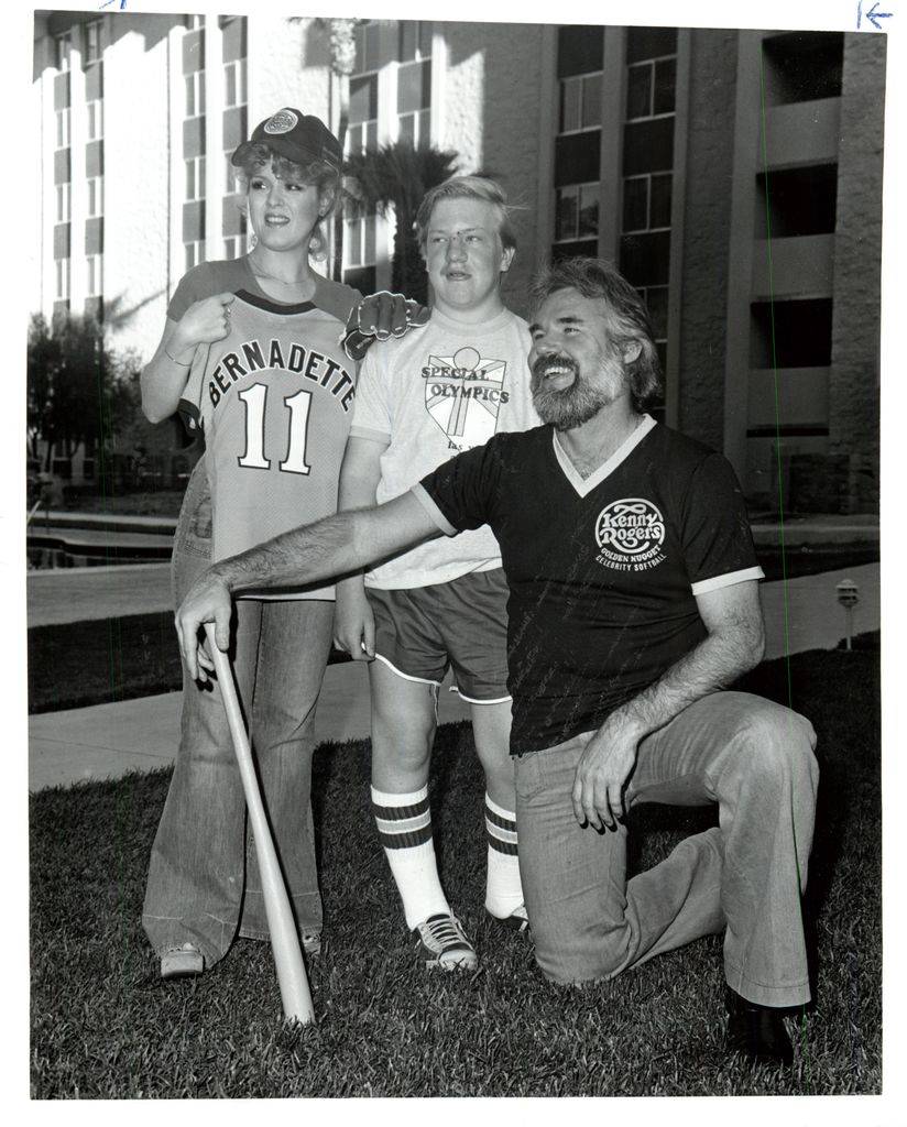 Kenny Rogers and Bernadette Peters with a participant of Special Olympics in an undated file ph ...