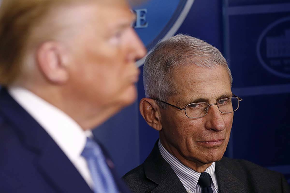Director of the National Institute of Allergy and Infectious Diseases Dr. Anthony Fauci, right, ...