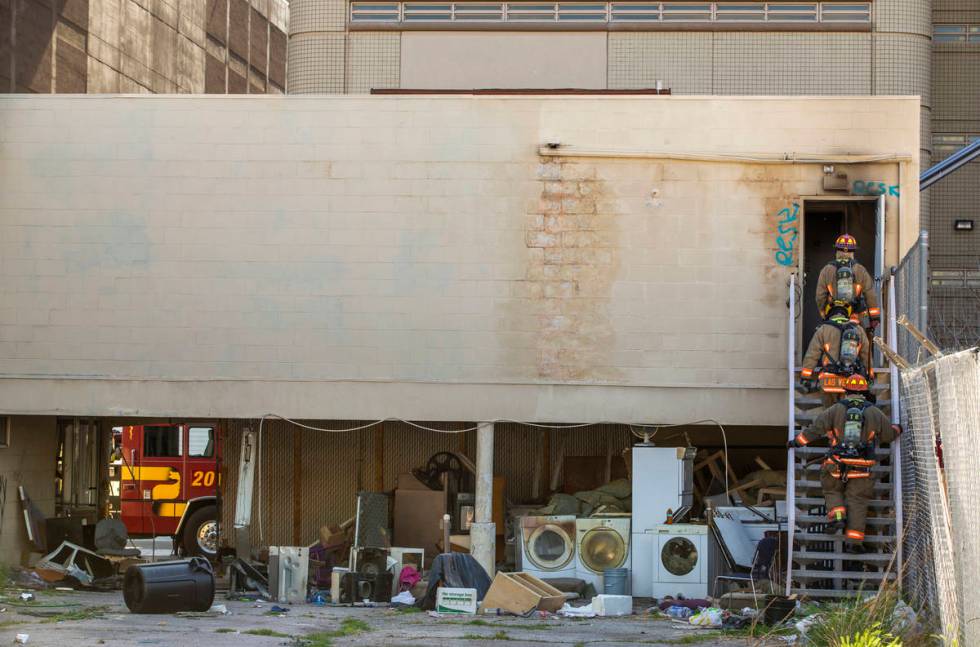 Las Vegas Fire Department personnel clear the building after a fire in a downtown Las Vegas vac ...