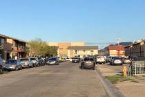 Police serve a warrant in a neighborhood on Corsaire Avenue in Las Vegas on Saturday, March 21, ...