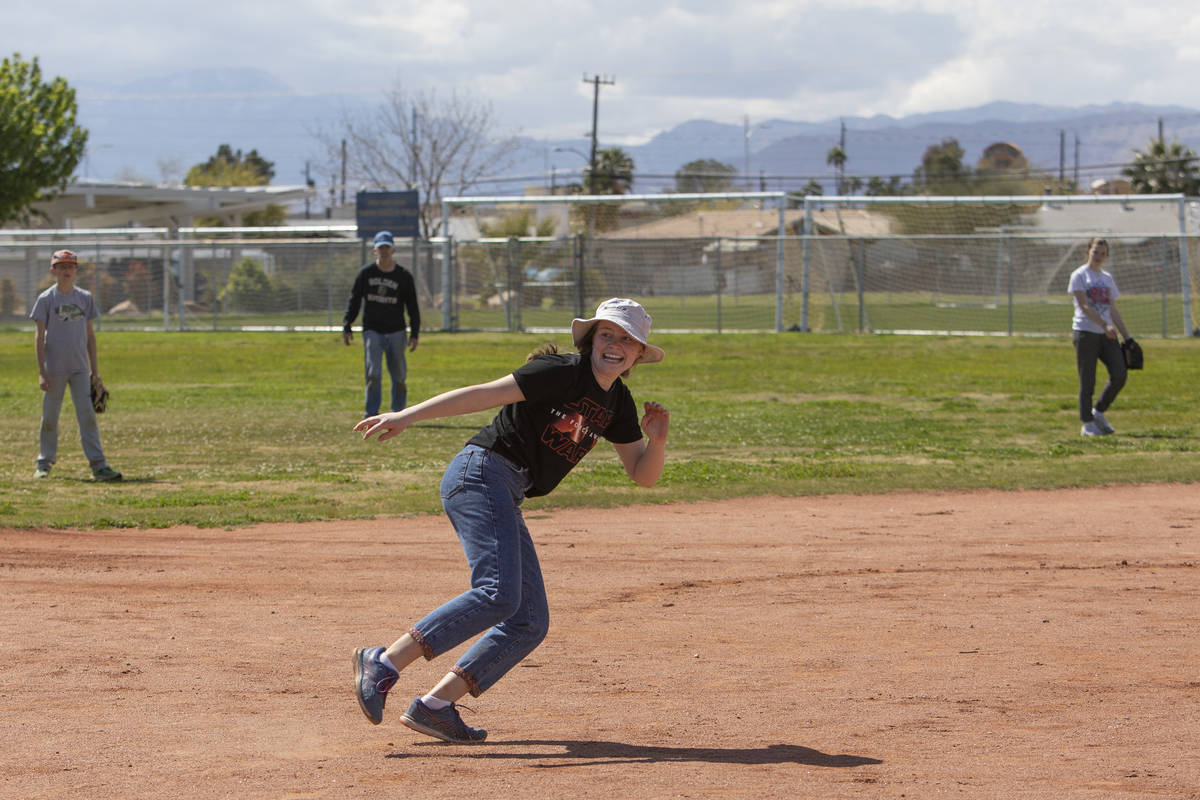 Rosina Gillette heads back to second base after the third baseman caught the ball at Beazer Hom ...