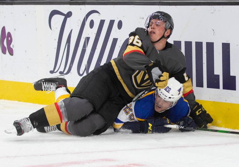 Vegas Golden Knights defenseman Nate Schmidt (88) collides with St. Louis Blues left wing Macke ...